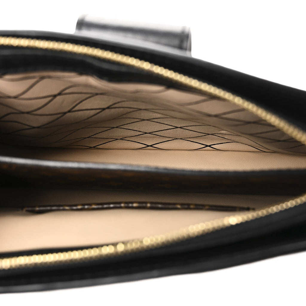 Reverse Monogram Trunk Clutch