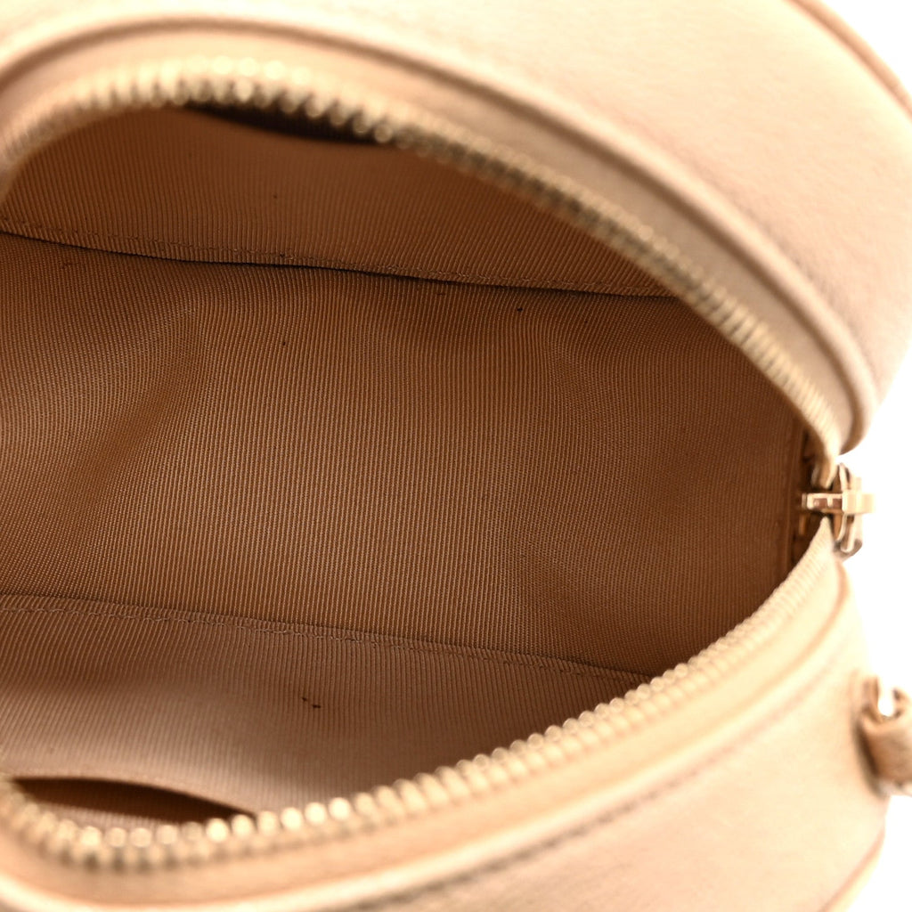 Iridescent Caviar Quilted Round Clutch With Chain Beige