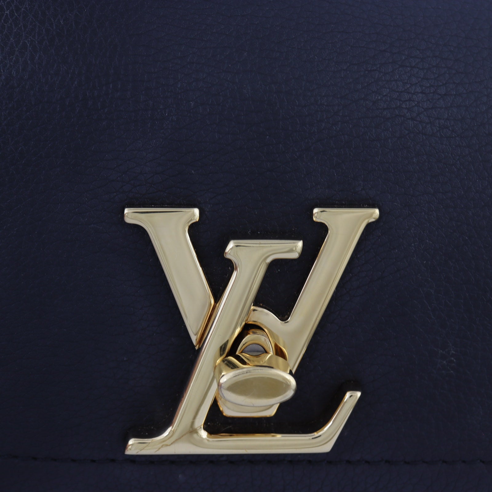 Louis Vuitton LockMe Tender