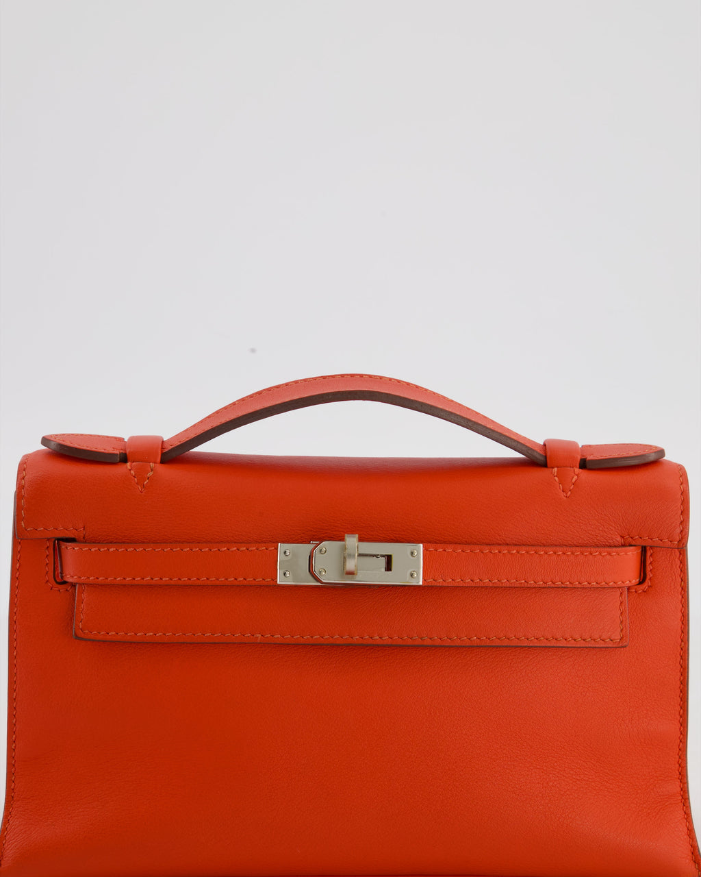 Hermès Kelly Pochette Bag in Capucine Swift Leather with Palladium Hardware