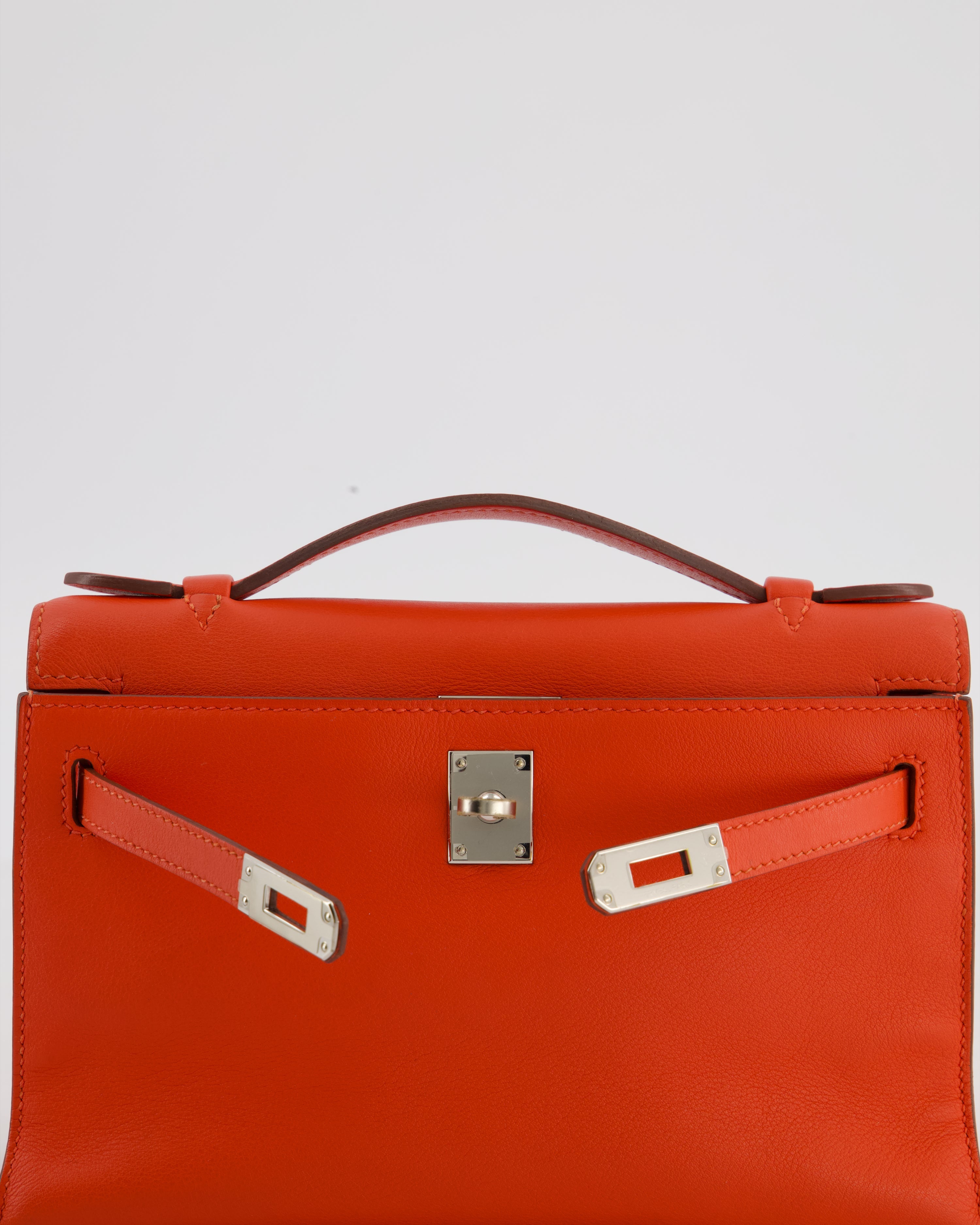 Hermès Kelly Pochette Bag in Capucine Swift Leather with Palladium Hardware