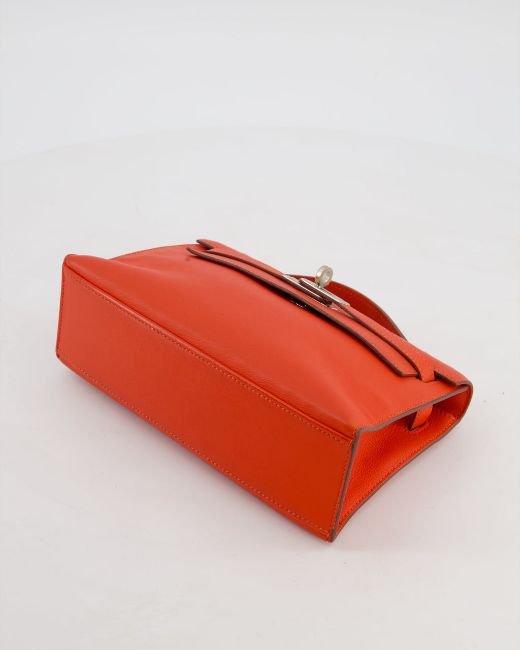 Hermès Kelly Pochette Bag in Capucine Swift Leather with Palladium Hardware