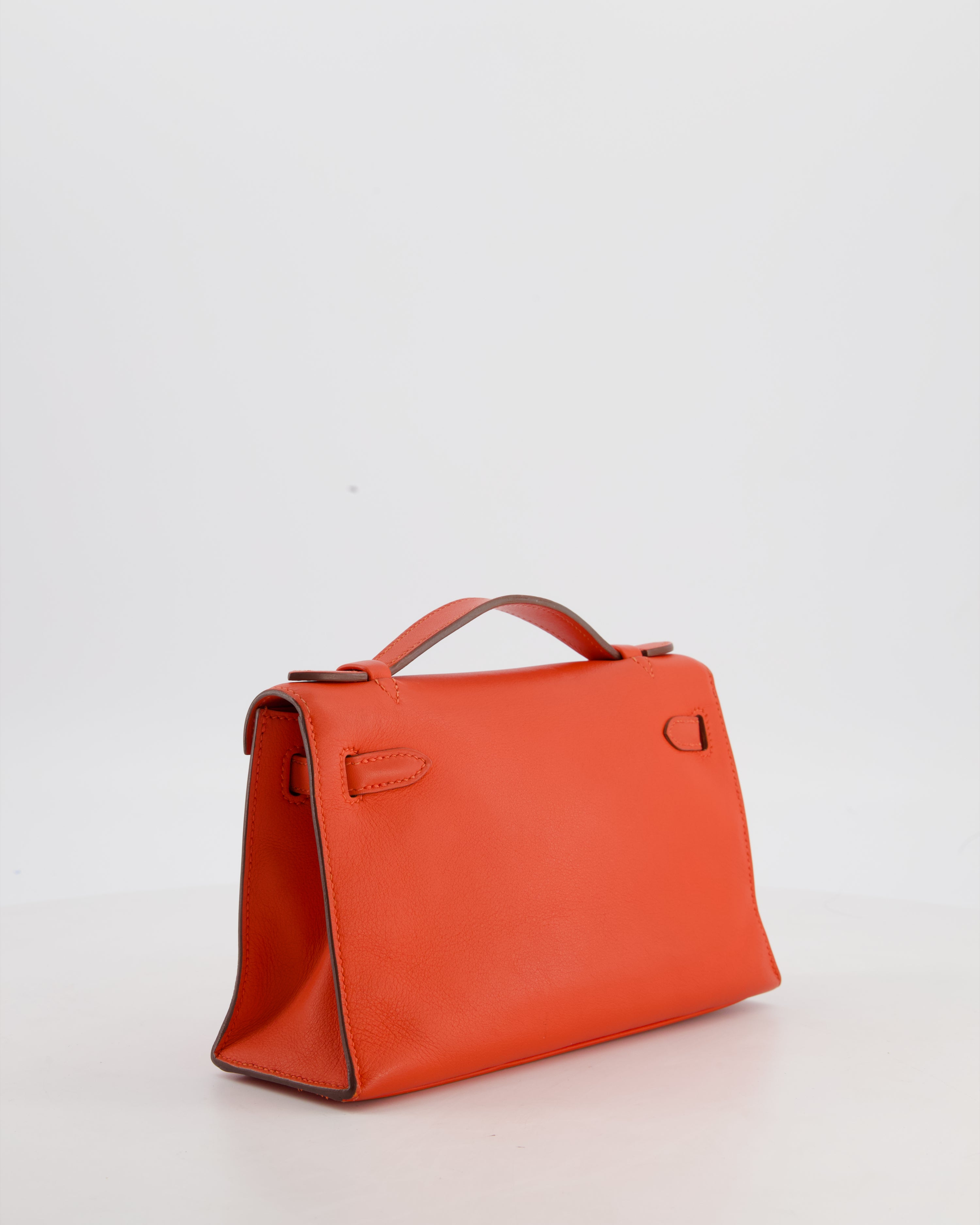 Hermès Kelly Pochette Bag in Capucine Swift Leather with Palladium Hardware