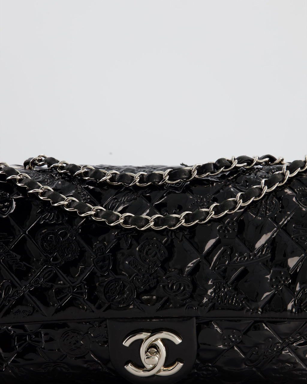 Chanel Black Patent East West Single Flap Bag with Embossed Charm Details and Silver Hardware