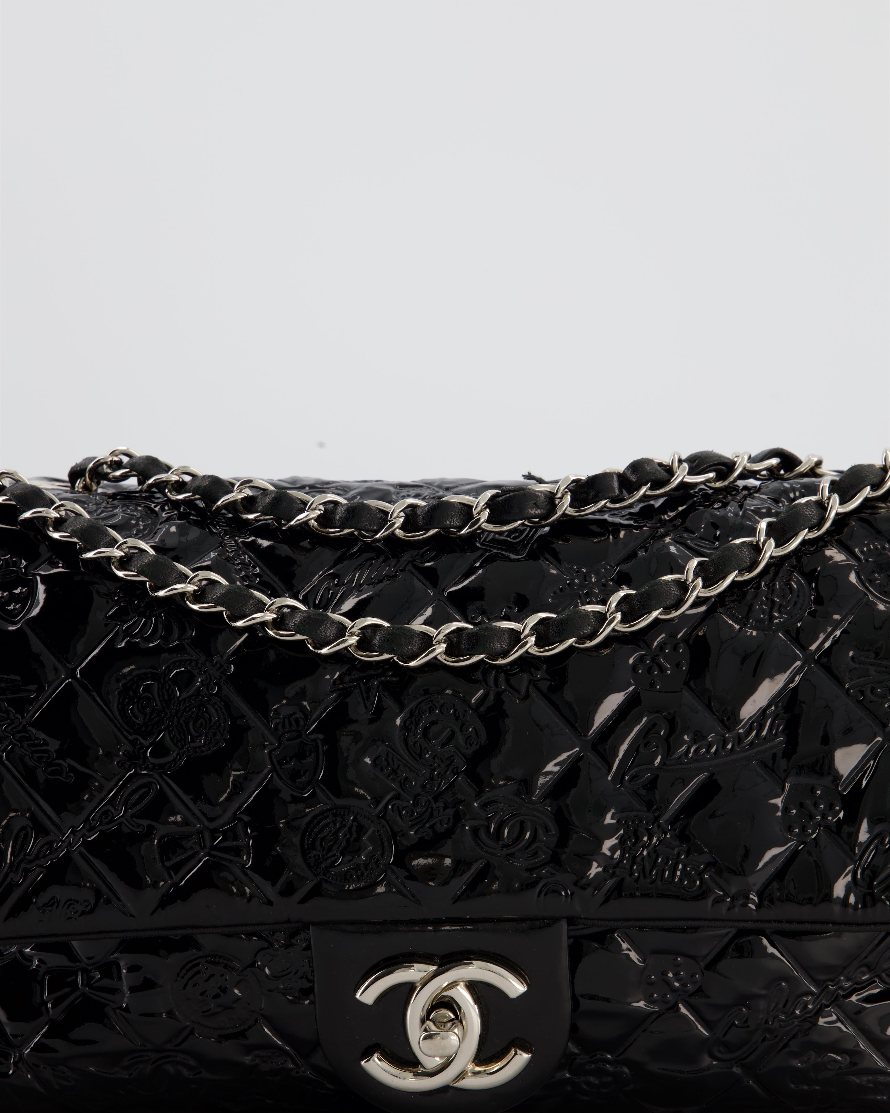 Chanel Black Patent East West Single Flap Bag with Embossed Charm Details and Silver Hardware