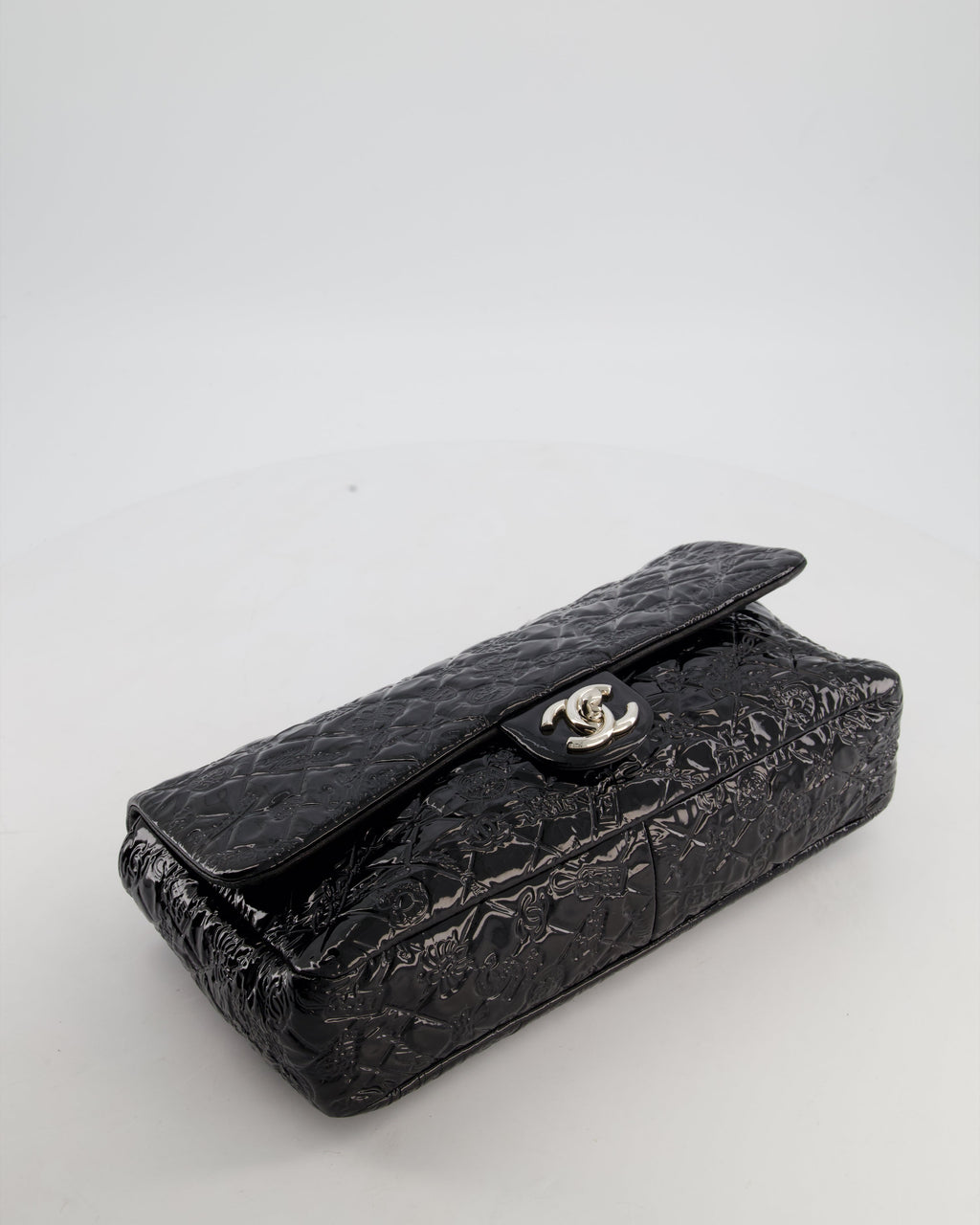 Chanel Black Patent East West Single Flap Bag with Embossed Charm Details and Silver Hardware