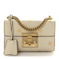 Grained Calfskin Bee Star Small Padlock Shoulder Bag White