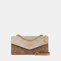 Coach Klare Envelope Crossbody Bag In Blocked Signature Canvas (Sand/Tan)