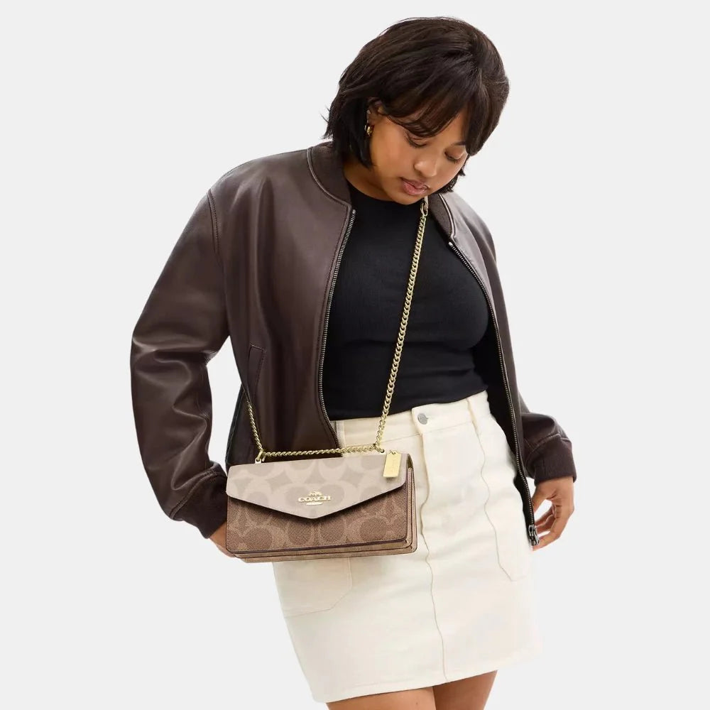Coach Klare Envelope Crossbody Bag In Blocked Signature Canvas (Sand/Tan)